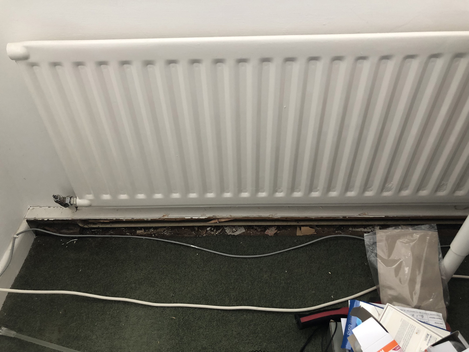 Horizontal wood boxing below radiator - removed the wood skirting safely, all good so far