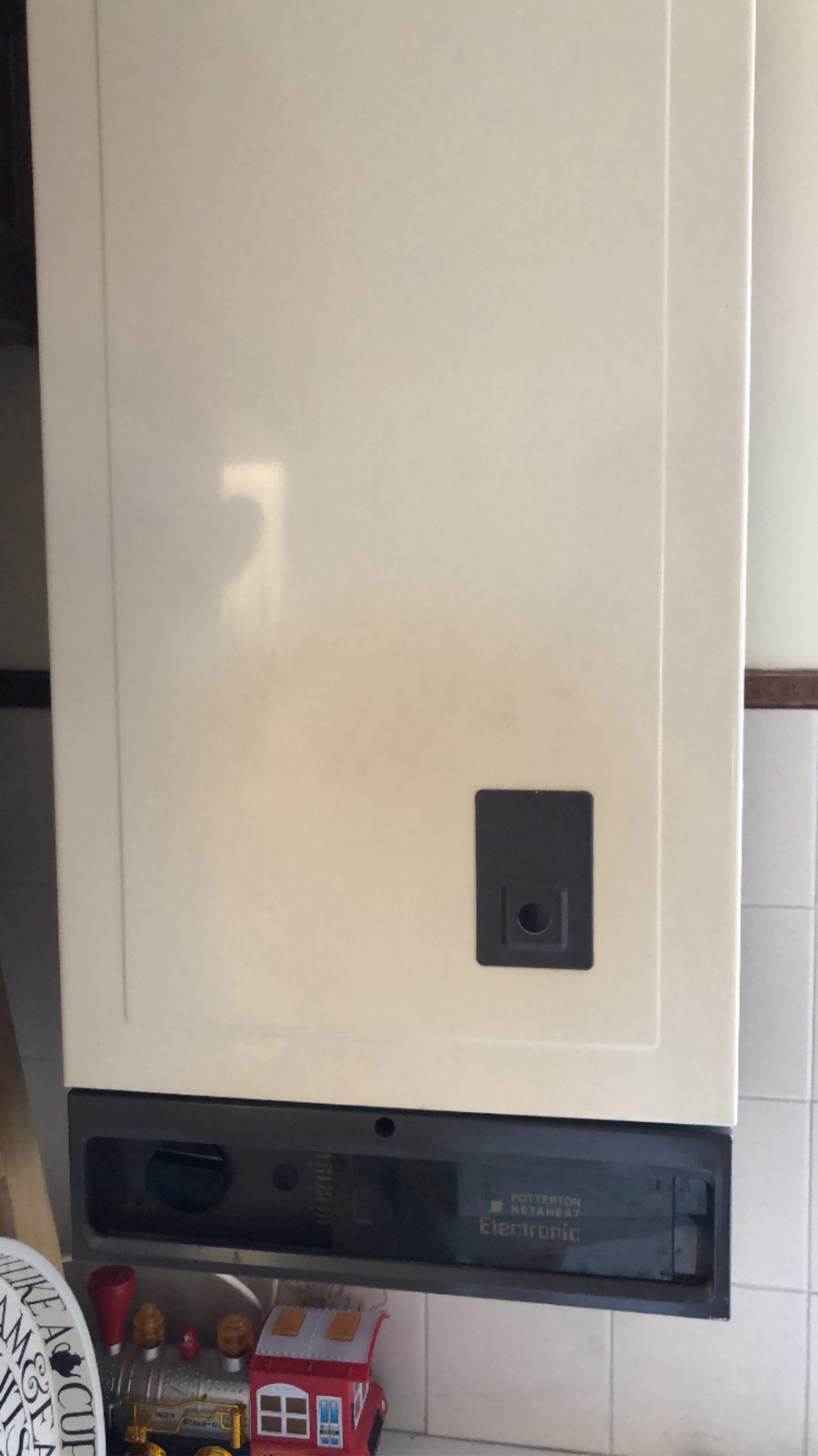 Potterton Netaheat 16/22 showing scorch marks from decades of operation - this boiler successfully heated the house for 40+ years