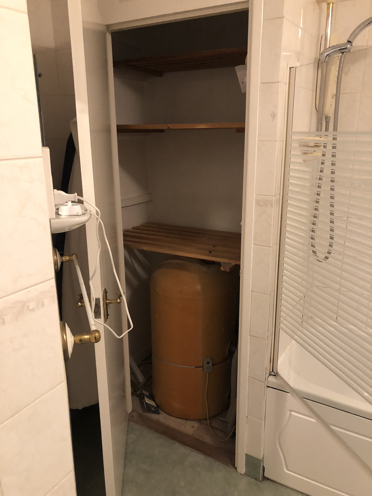 Airing cupboard cleared and ready for conversion to combi system