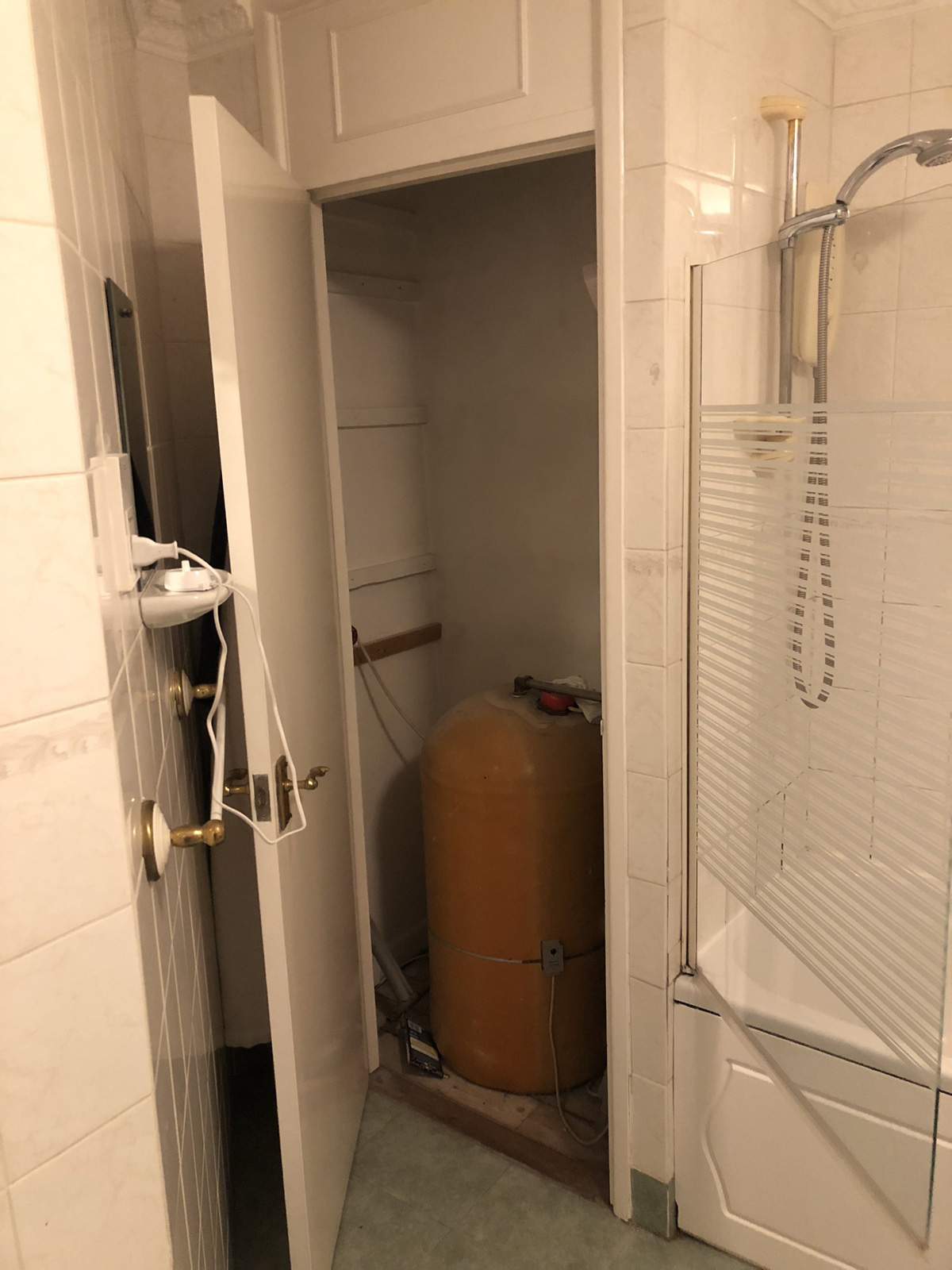 Mid-installation - hot water cylinder removal in progress as part of system-to-combi conversion