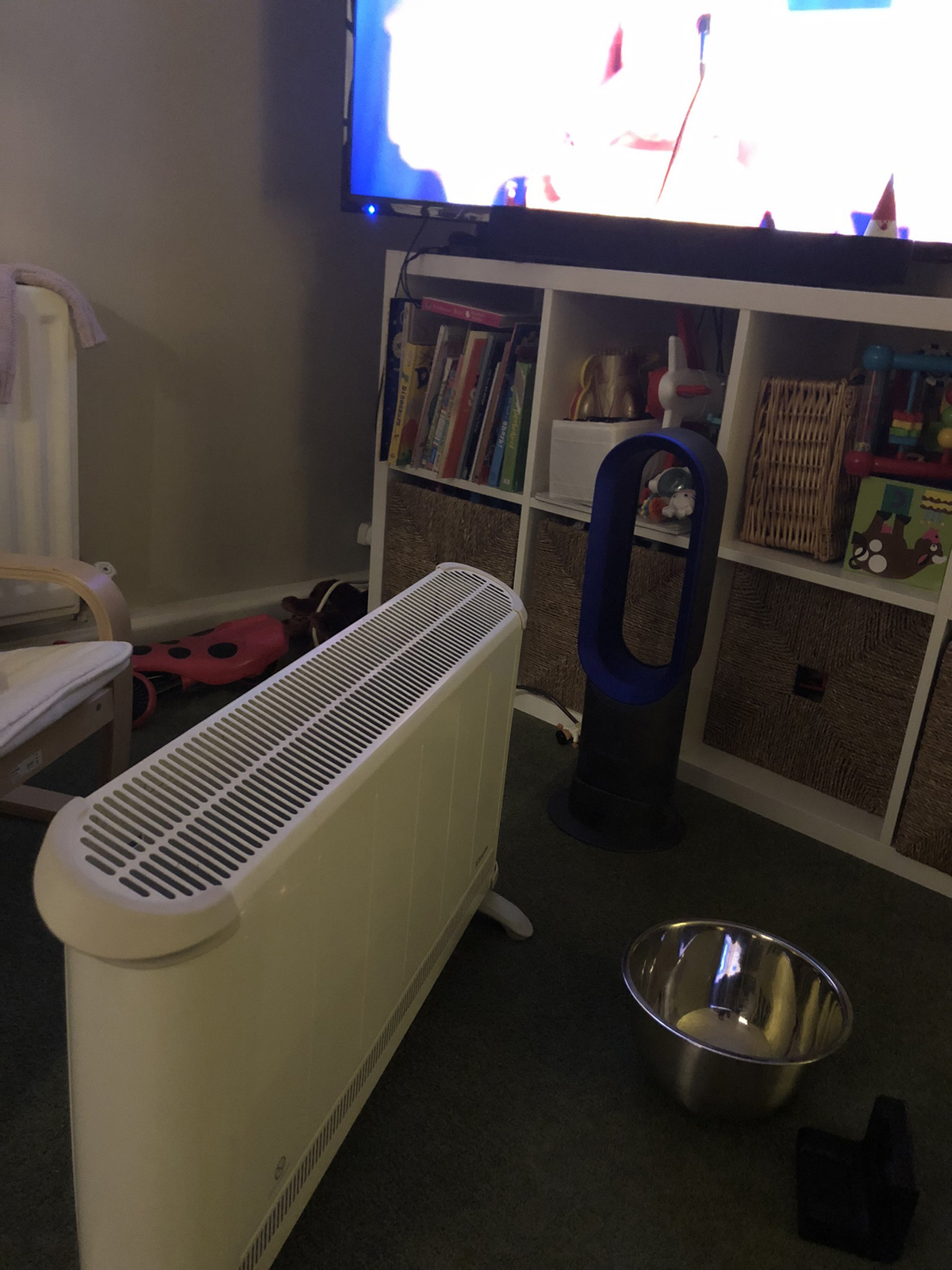 Convection heater and Dyson heating living room where son and user spent time