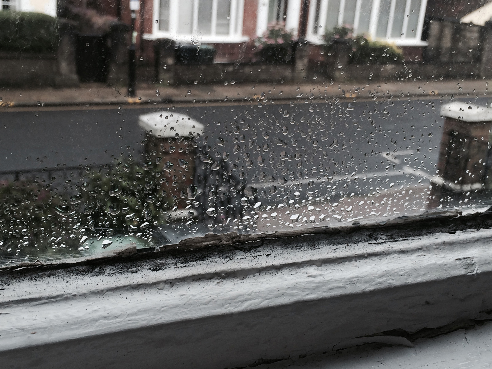 Window pane with condensation and mould