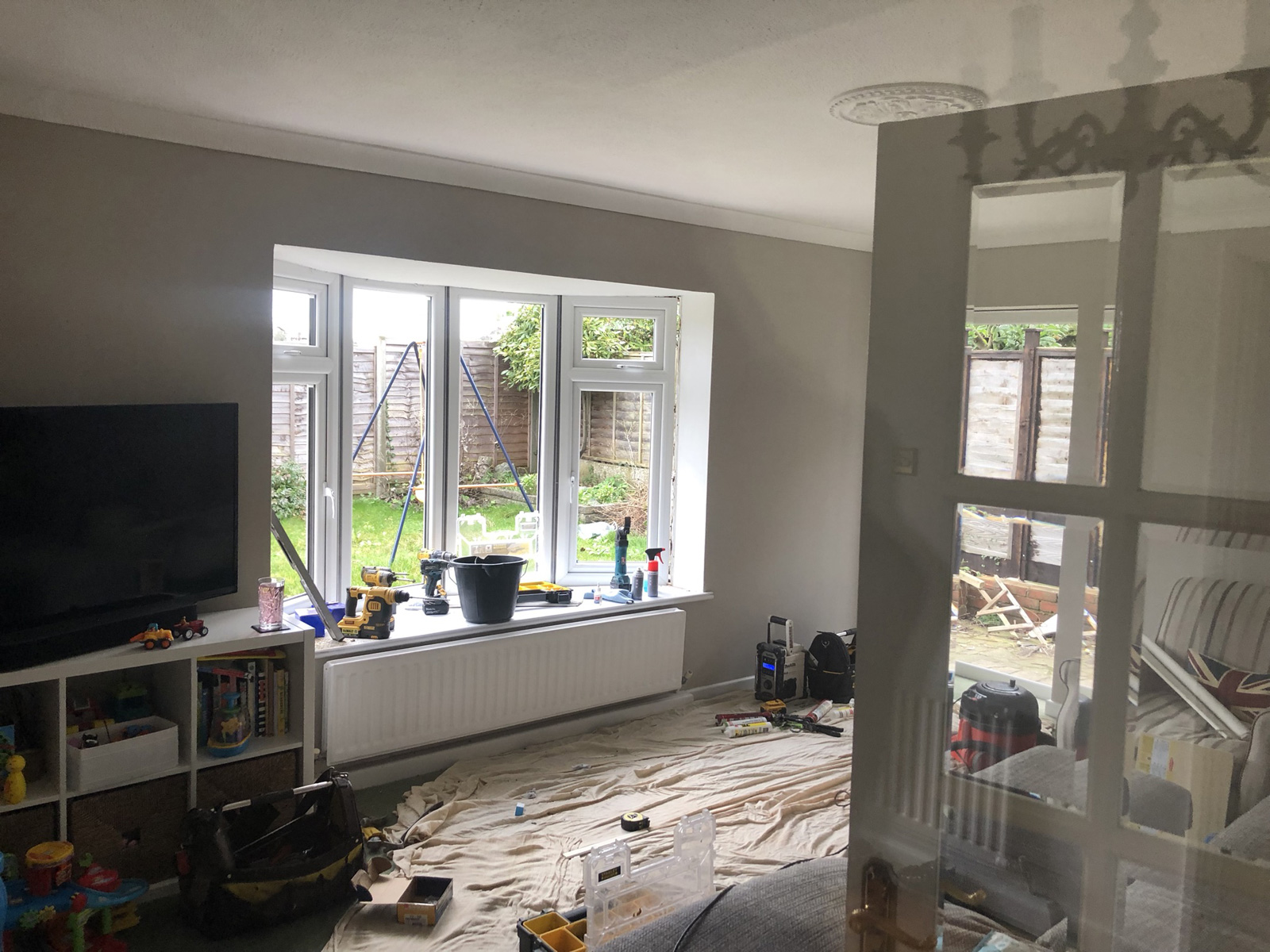 Installation in progress - living room bay window and side door being fitted in Phase 1