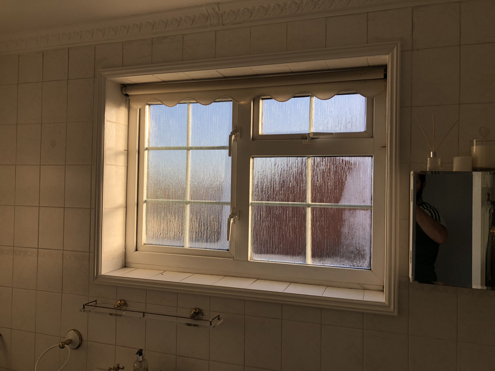 Old 1970s double glazed bathroom window showing age and wear after 52 years