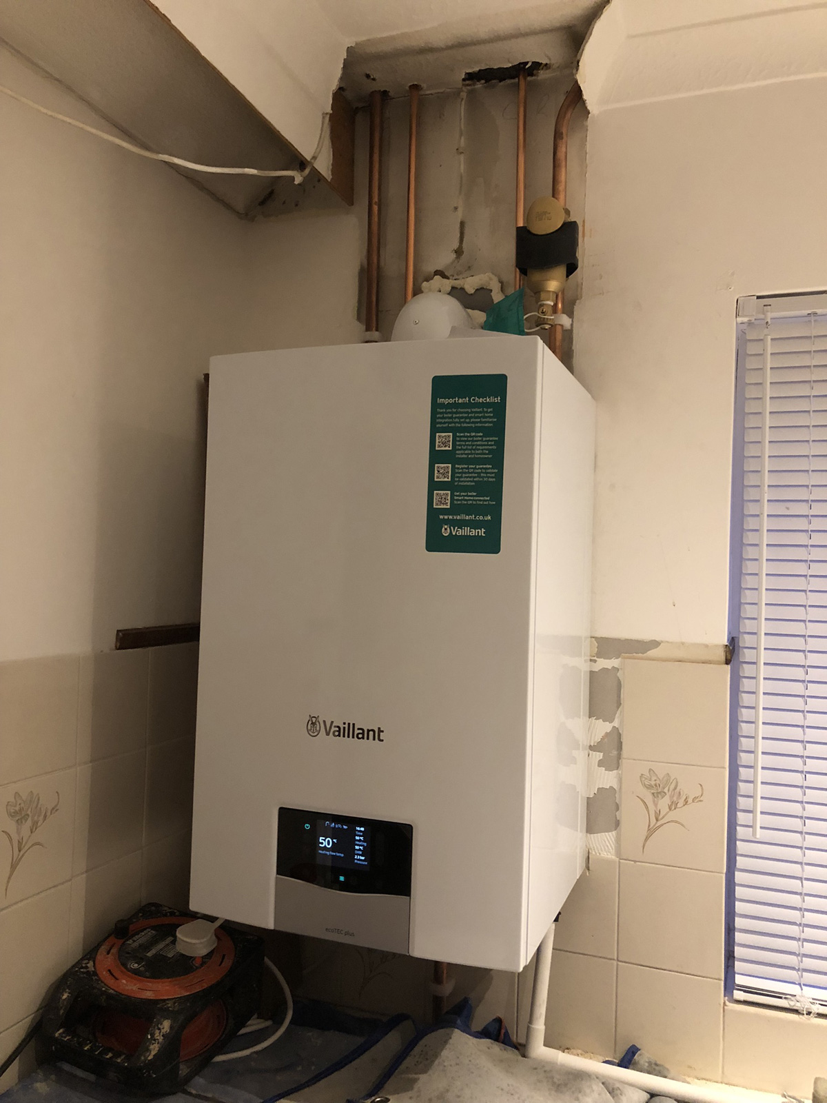 Vaillant 826 partially installed and piped up in kitchen